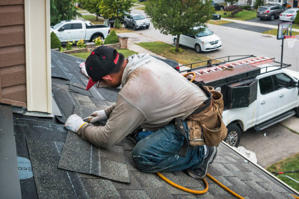 Professional Roofing technician working in Ruby, NY